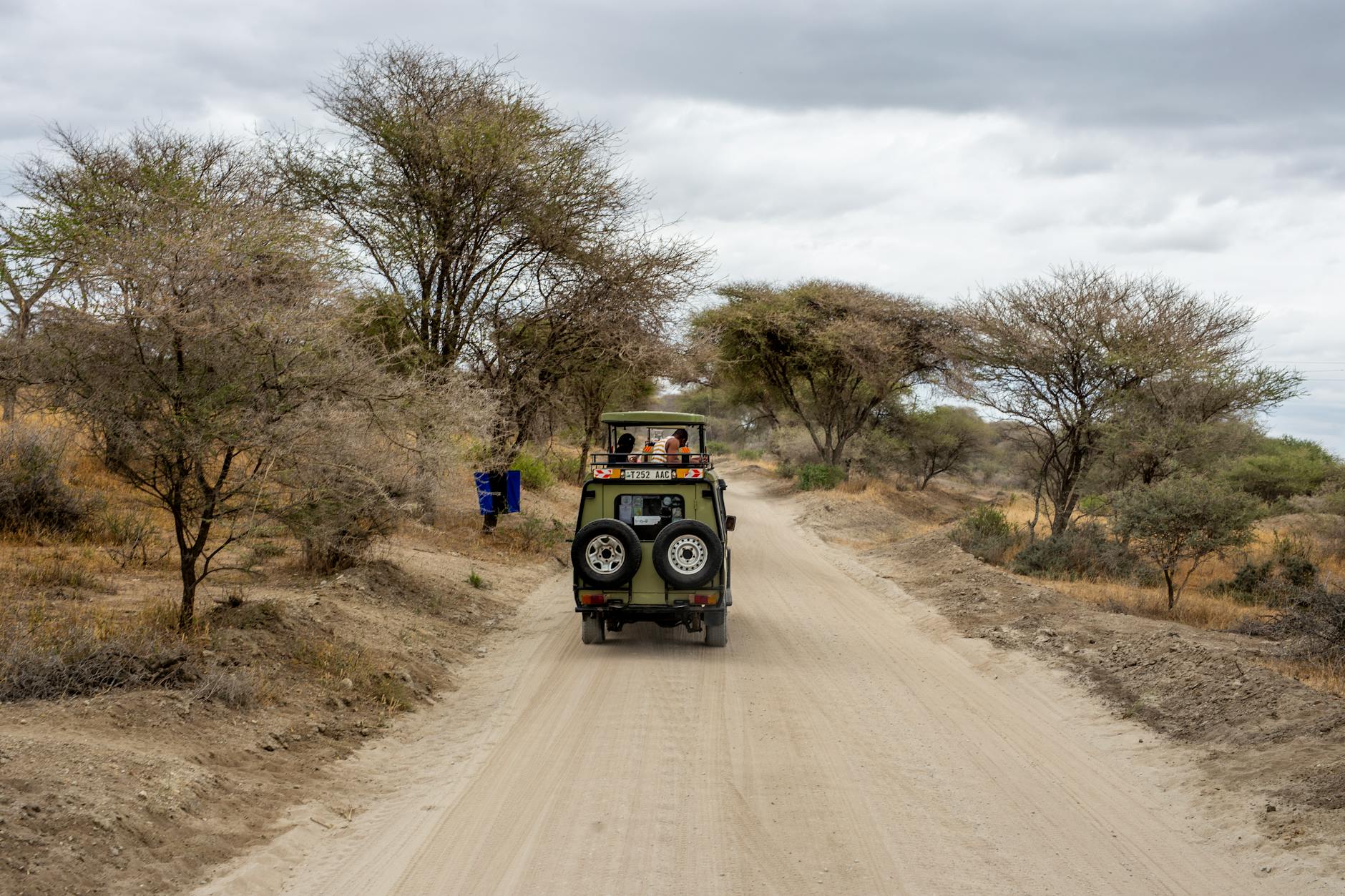 Horseback safari riders trekking through the African savanna with wildlife in Laikipia Kenya