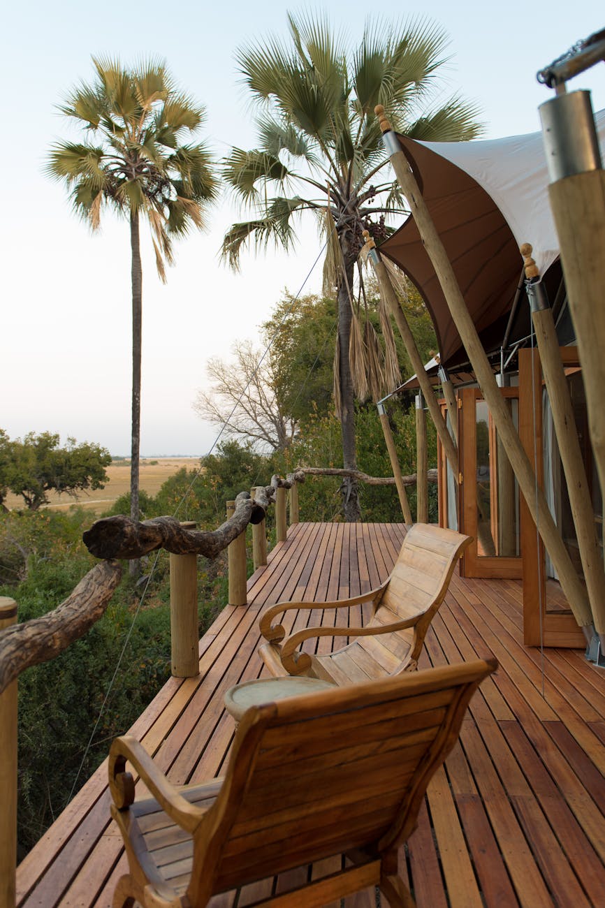 Scenic view from a luxury safari lodge deck overlooking the Laikipia landscape in Kenya