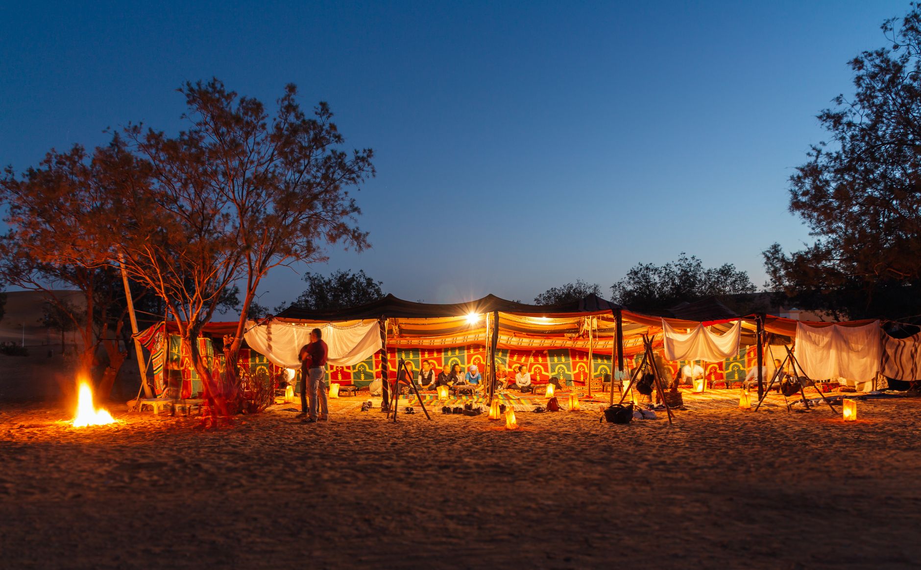 Atmospheric campfire and night-camp photography